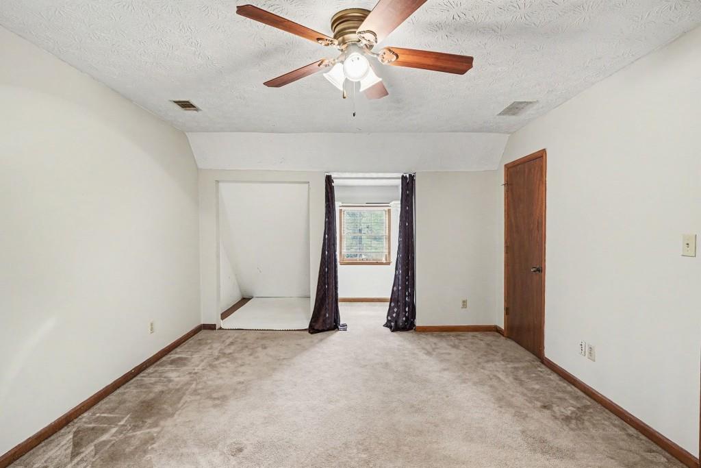 114 Copeland Lane Stockbridge, GA 30281 - Photo 31 of 40 an empty room with closet and a ceiling fan
