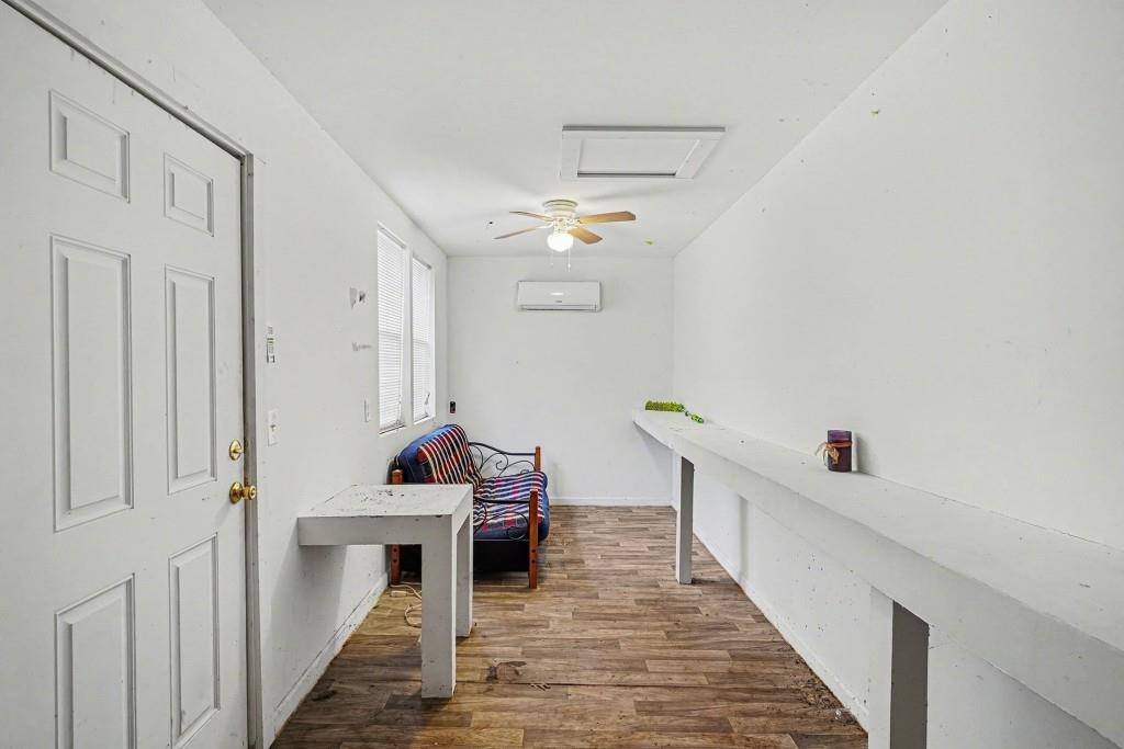 114 Copeland Lane Stockbridge, GA 30281 - Photo 35 of 40 a hallway has a baby crib lounge chair and a chandelier fan
