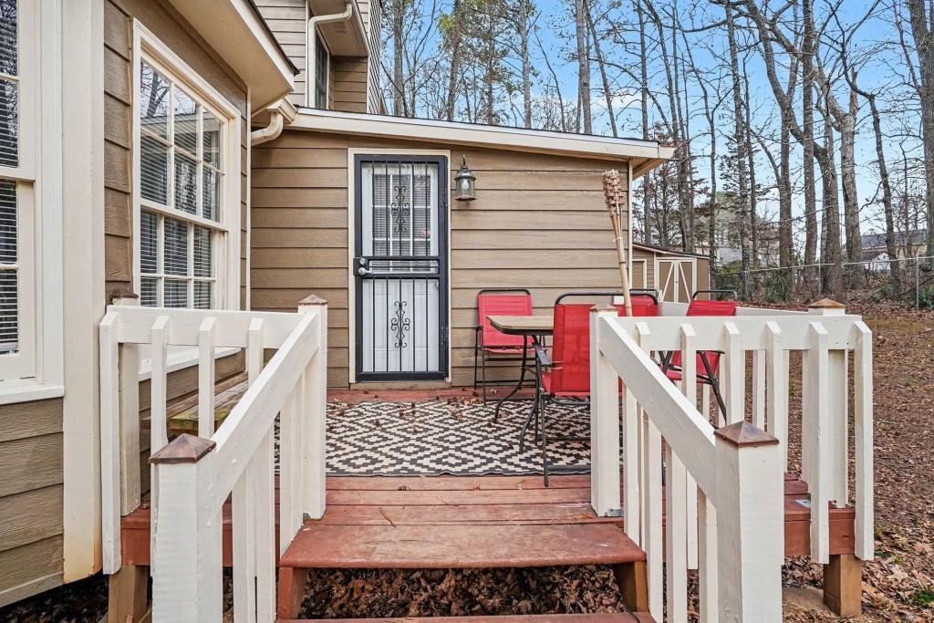 114 Copeland Lane Stockbridge, GA 30281 - Photo 7 of 40 a view of a house with wooden fence and trees