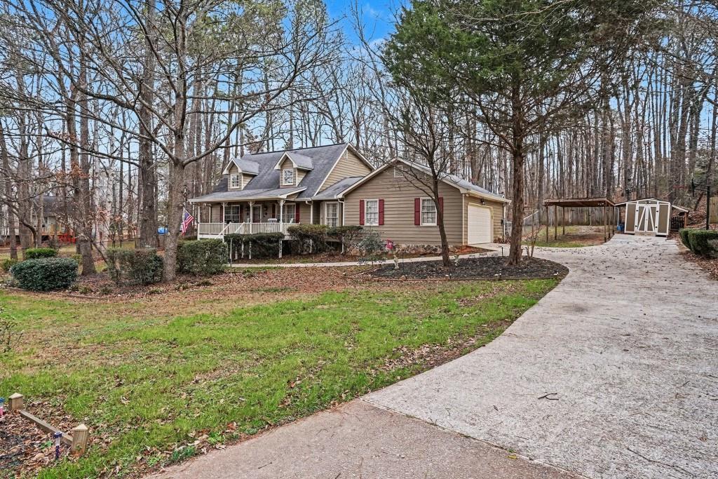 114 Copeland Lane Stockbridge, GA 30281 - Photo 9 of 40 a front view of a house with a yard and trees