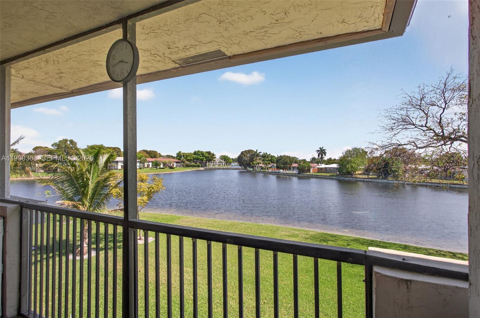 9670 West McNab Road, Unit 208 Tamarac, FL 33321 - Photo 19 of 47 a view of a lake from a balcony