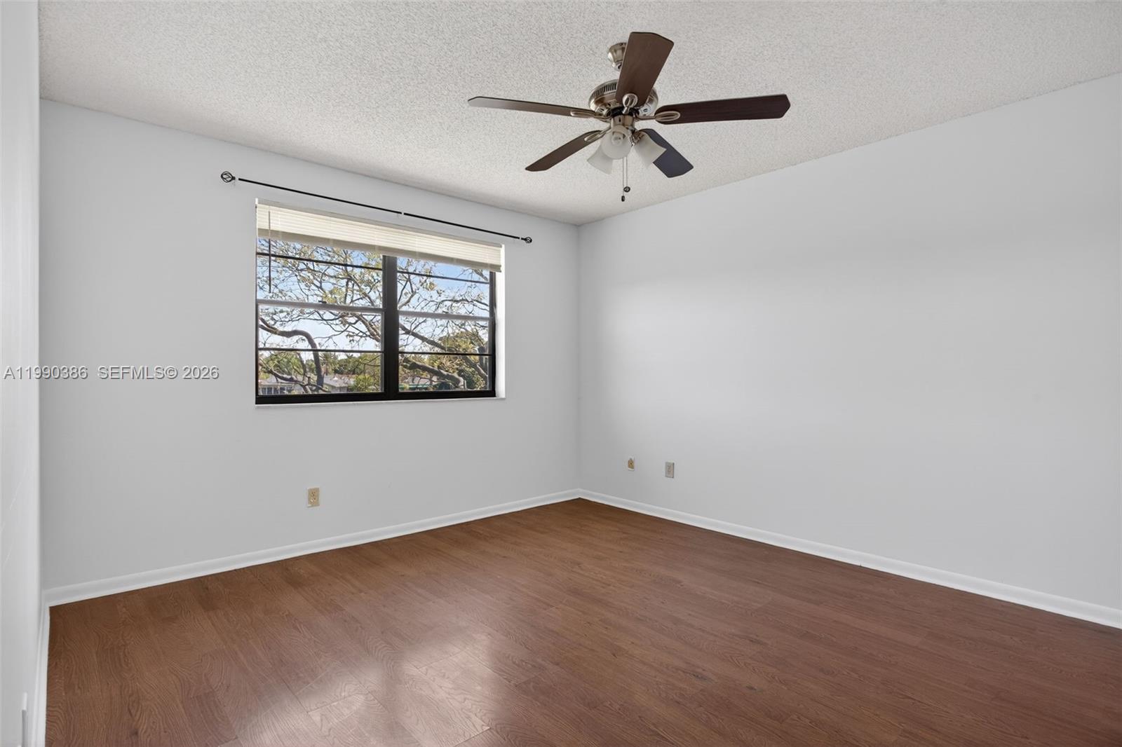 9670 West McNab Road, Unit 208 Tamarac, FL 33321 - Photo 23 of 47 a view of a big room with wooden floor closet and windows