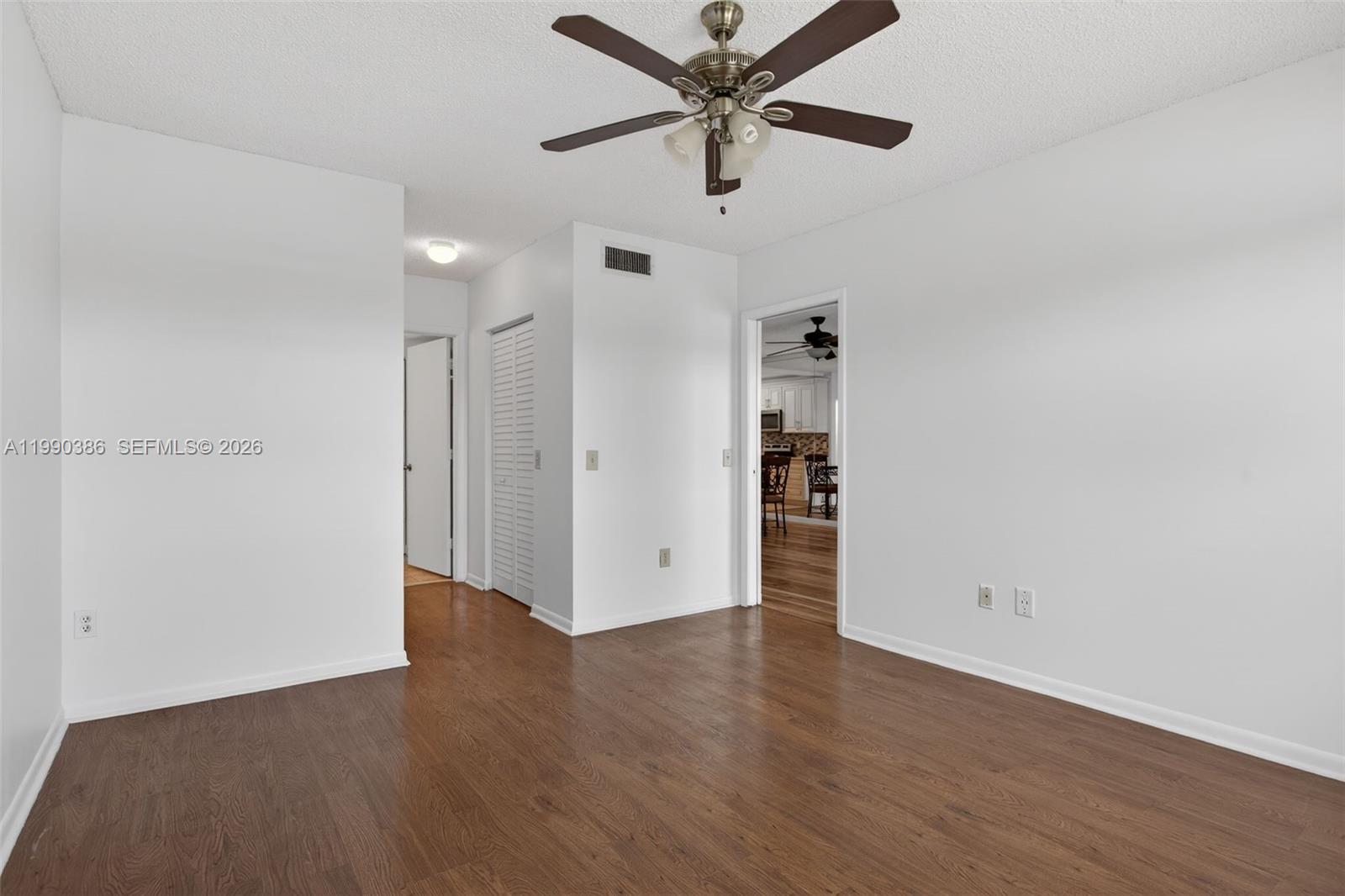 9670 West McNab Road, Unit 208 Tamarac, FL 33321 - Photo 24 of 47 wooden floor in an empty room