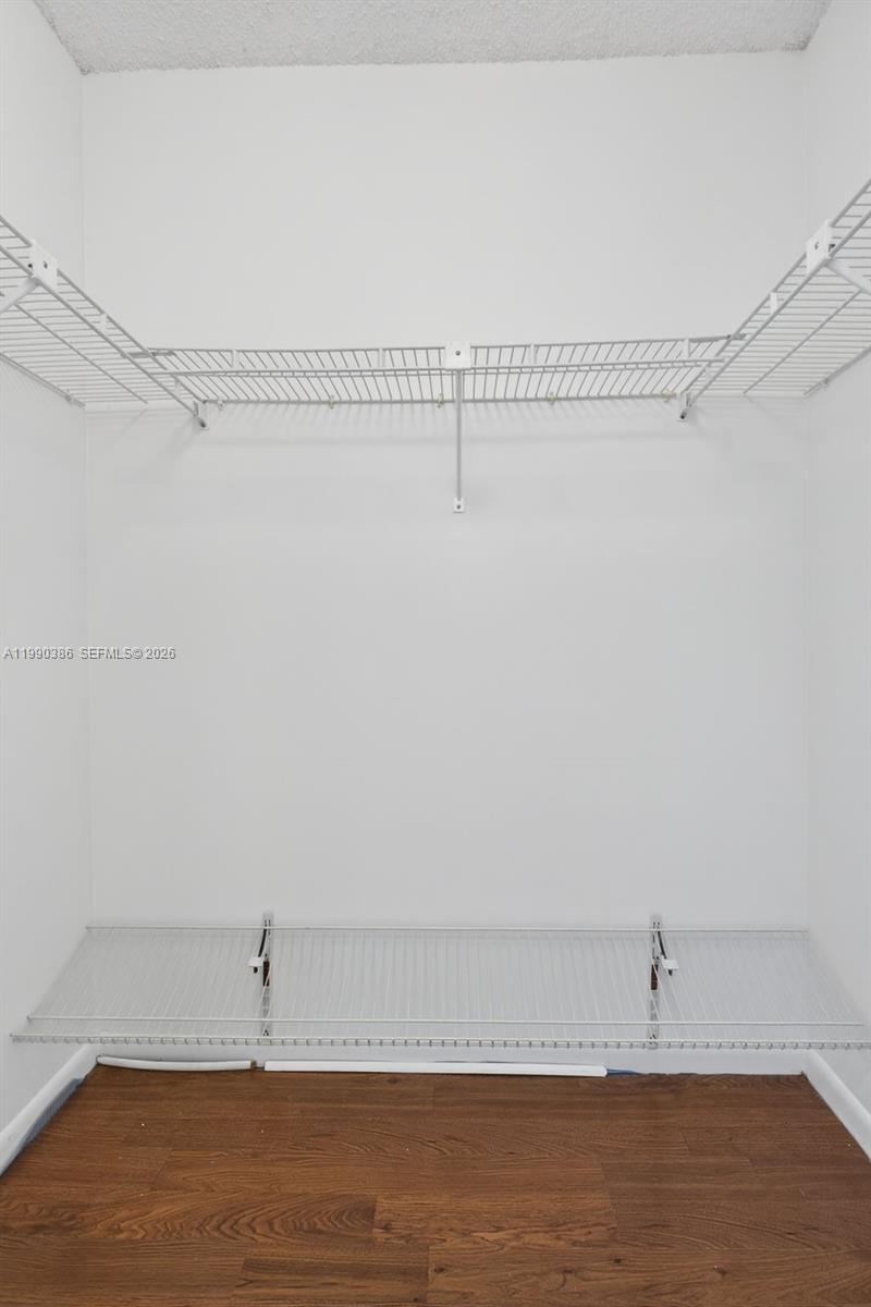 9670 West McNab Road, Unit 208 Tamarac, FL 33321 - Photo 25 of 47 a view of a room with racks on the wall