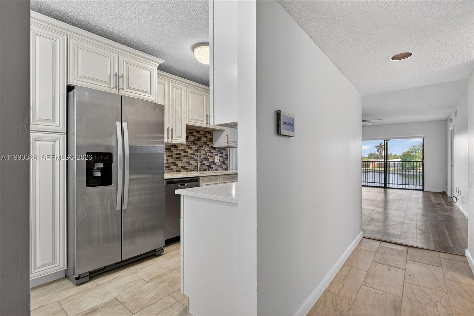 9670 West McNab Road, Unit 208 Tamarac, FL 33321 - Photo 4 of 47 a kitchen with stainless steel appliances granite countertop a refrigerator and a sink