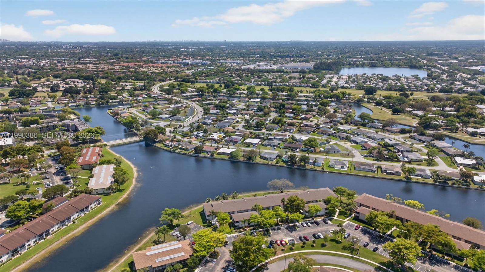 9670 West McNab Road, Unit 208 Tamarac, FL 33321 - Photo 43 of 47 an aerial view of a house with a lake view