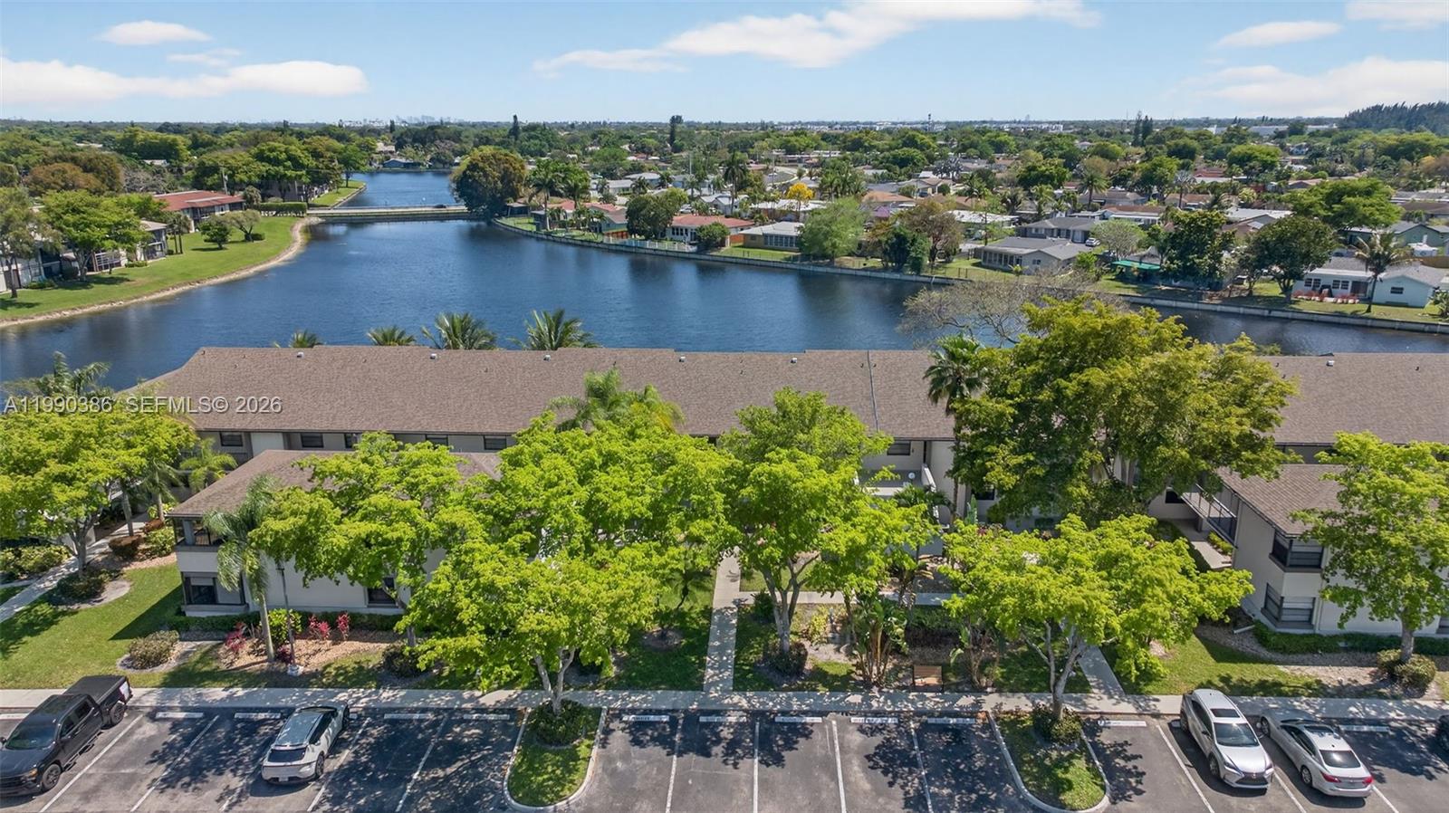 9670 West McNab Road, Unit 208 Tamarac, FL 33321 - Photo 46 of 47 an aerial view of a house with a lake view