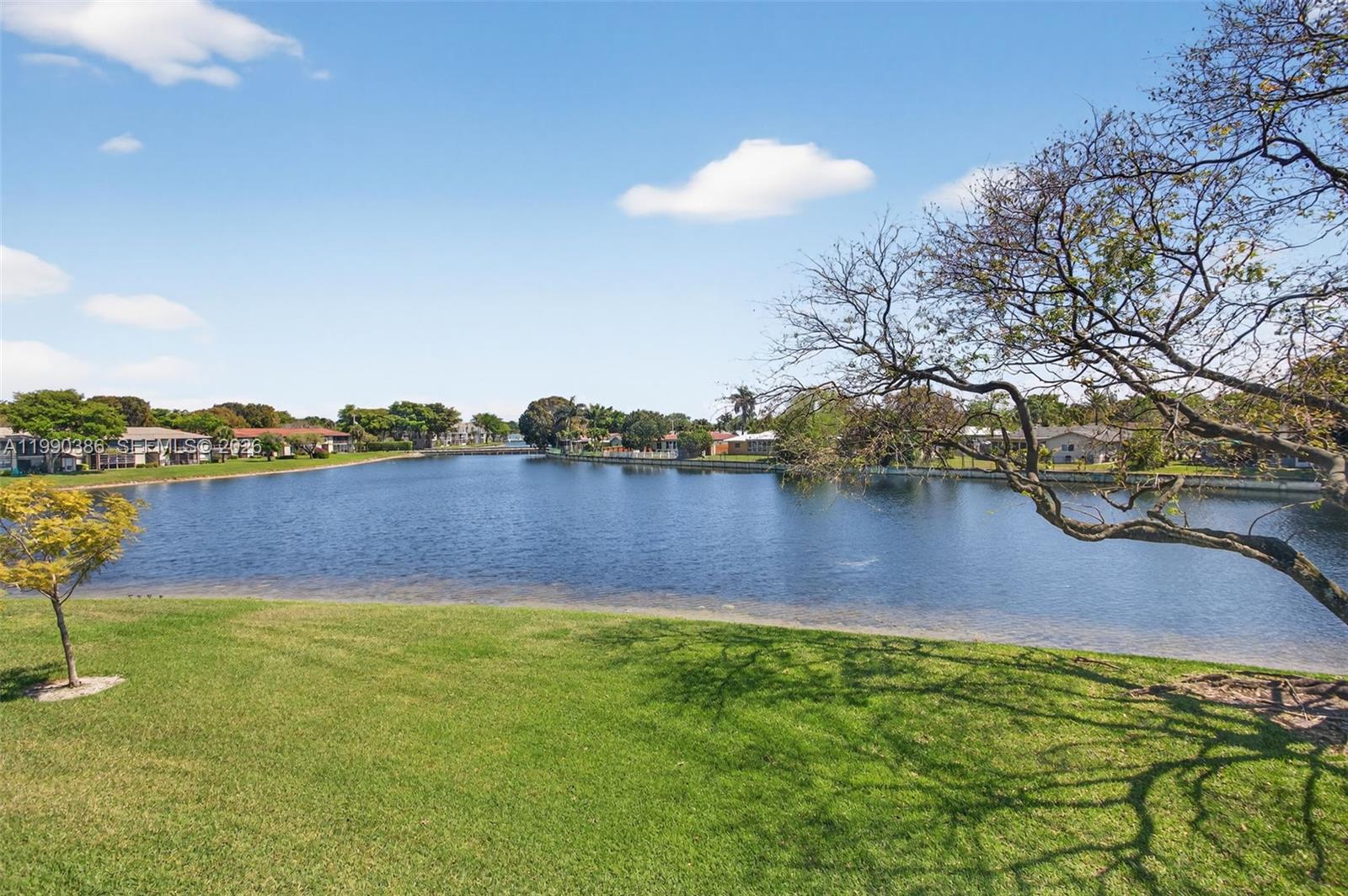 9670 West McNab Road, Unit 208 Tamarac, FL 33321 - Photo 47 of 47 a view of a lake with houses in the back
