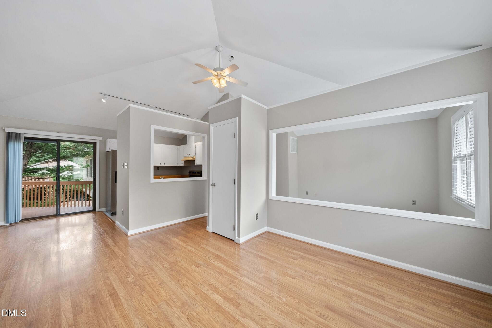 3634 Mill Run Raleigh, NC 27612 - Photo 6 of 18 a view of an empty room with wooden floor and a window