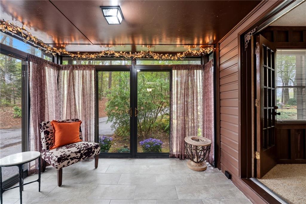 3121 Bonds Lake Road Northwest Conyers, GA 30012 - Photo 14 of 36 a outdoor space with patio furniture and a window