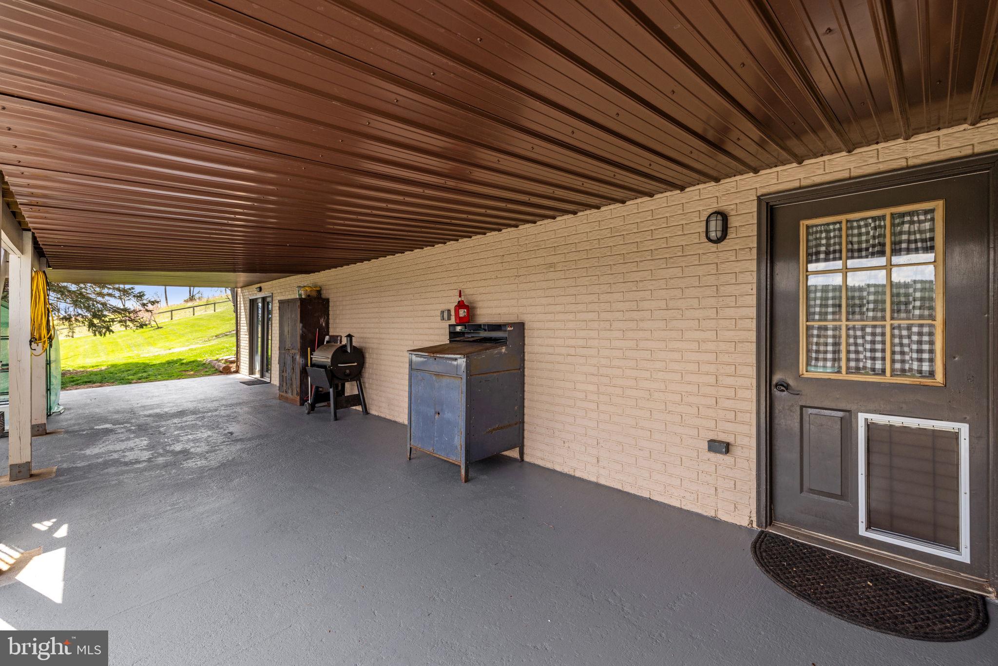 740 Whitacre Road Gore, VA 22637 - Photo 68 of 95 Large Lower Level Covered Patio w/Multi Access
