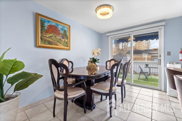 285 Water Street Perth Amboy, NJ 08861 - Photo 6 of 16 a view of a dining room with furniture window and outside view