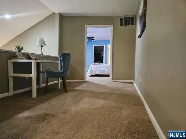 a workspace with furniture and a window