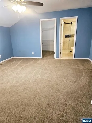 an empty room with closet area