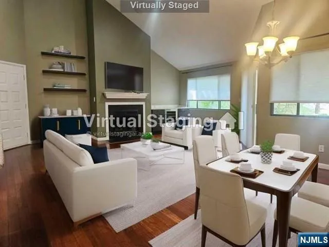 a living room with fireplace furniture and a flat screen tv
