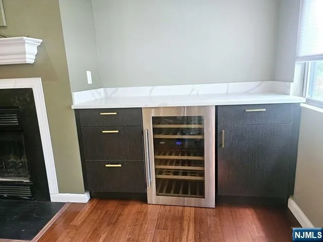 a room with a wooden floor and a fireplace