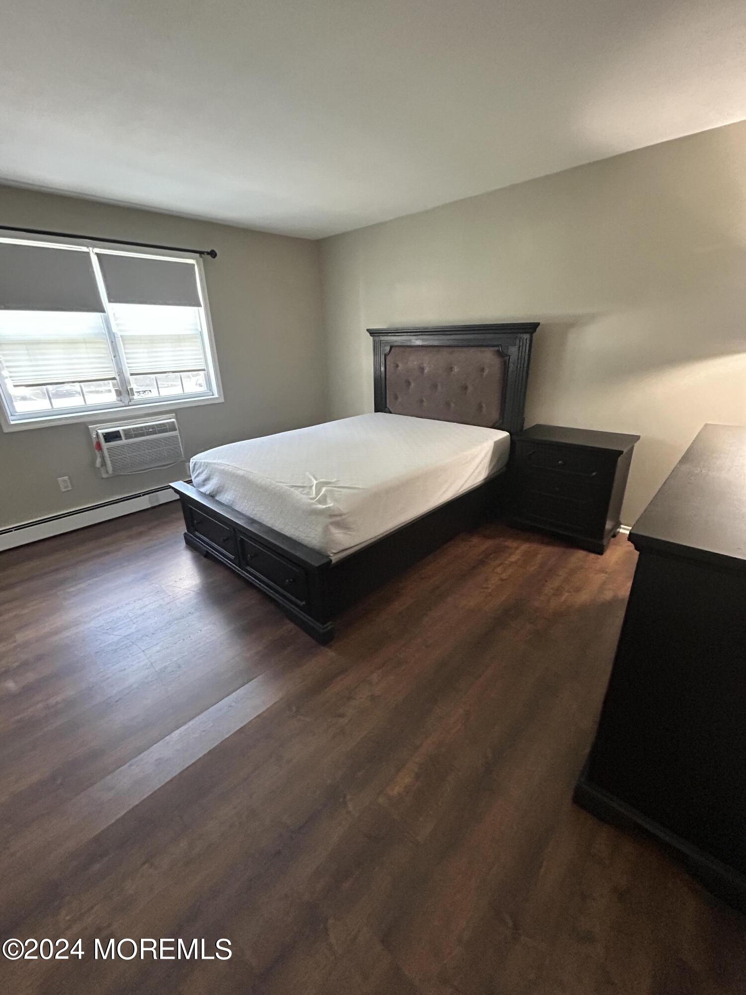 12 Manchester Court, Unit C Freehold, NJ 07728 - Photo 16 of 16 a bedroom with a bed and a window