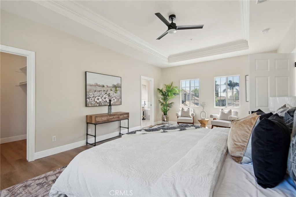 321 Diamond Street, Unit C Arcadia, CA 91006 - Photo 23 of 40 a spacious bedroom with a bed a couch and a potted plant