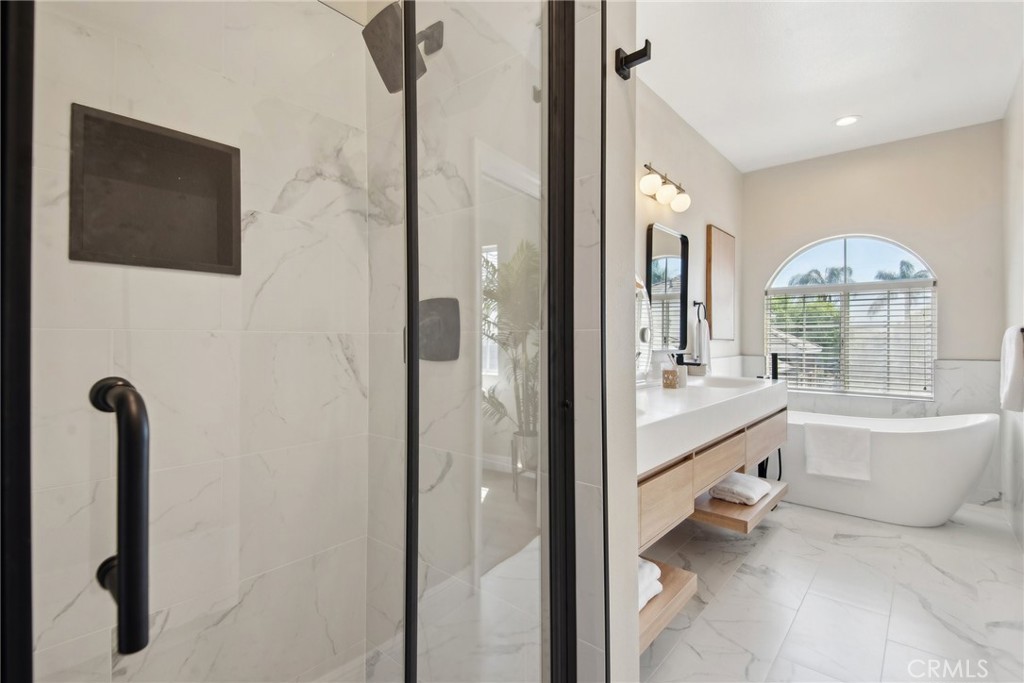 321 Diamond Street, Unit C Arcadia, CA 91006 - Photo 27 of 40 a bathroom with a tub mirror and window