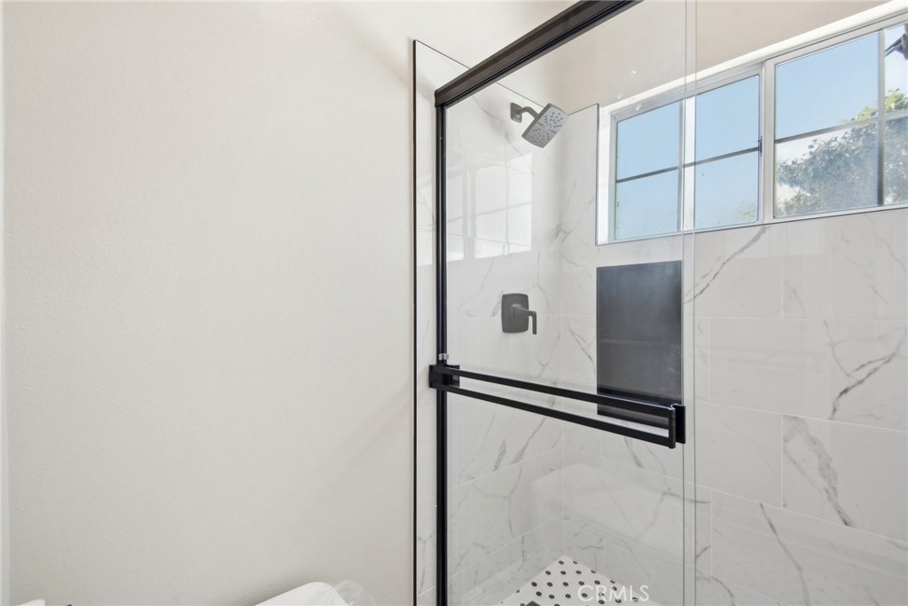 321 Diamond Street, Unit C Arcadia, CA 91006 - Photo 35 of 40 a bathroom with a shower and a mirror