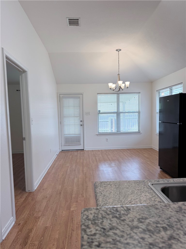 1029 Fallbrook Loop College Station, TX 77845 - Photo 9 of 34 an empty room with windows and a fireplace