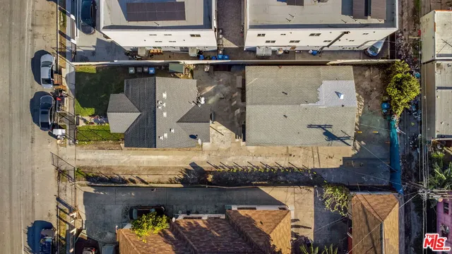 an aerial view of a residential houses with city view