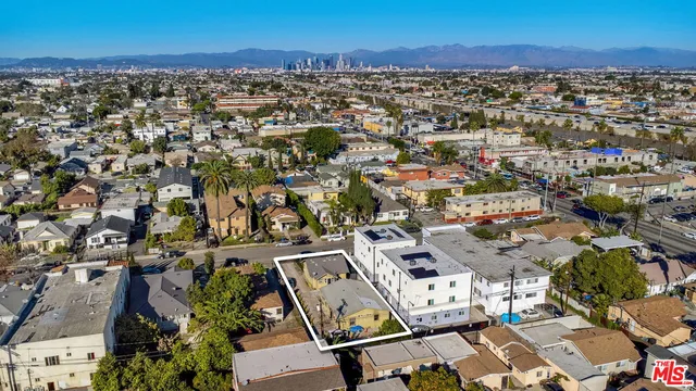 an aerial view of a city with lots of residential buildings