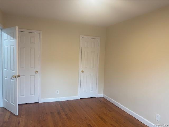 14 South Broadway, Unit 102B Irvington, NY 10533 - Photo 12 of 16 a view of an empty room with wooden floor