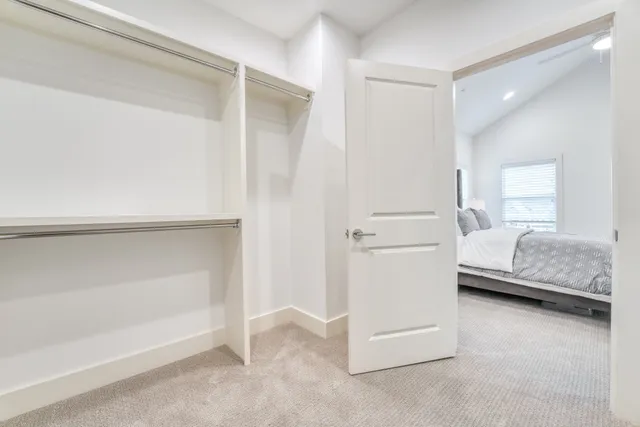 a bedroom with a bed and a cabinets