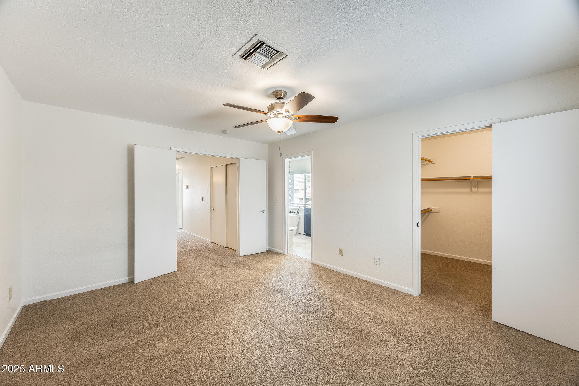 1929 East Redfield Road Phoenix, AZ 85022 - Photo 32 of 58 a view of an empty room with a ceiling fan