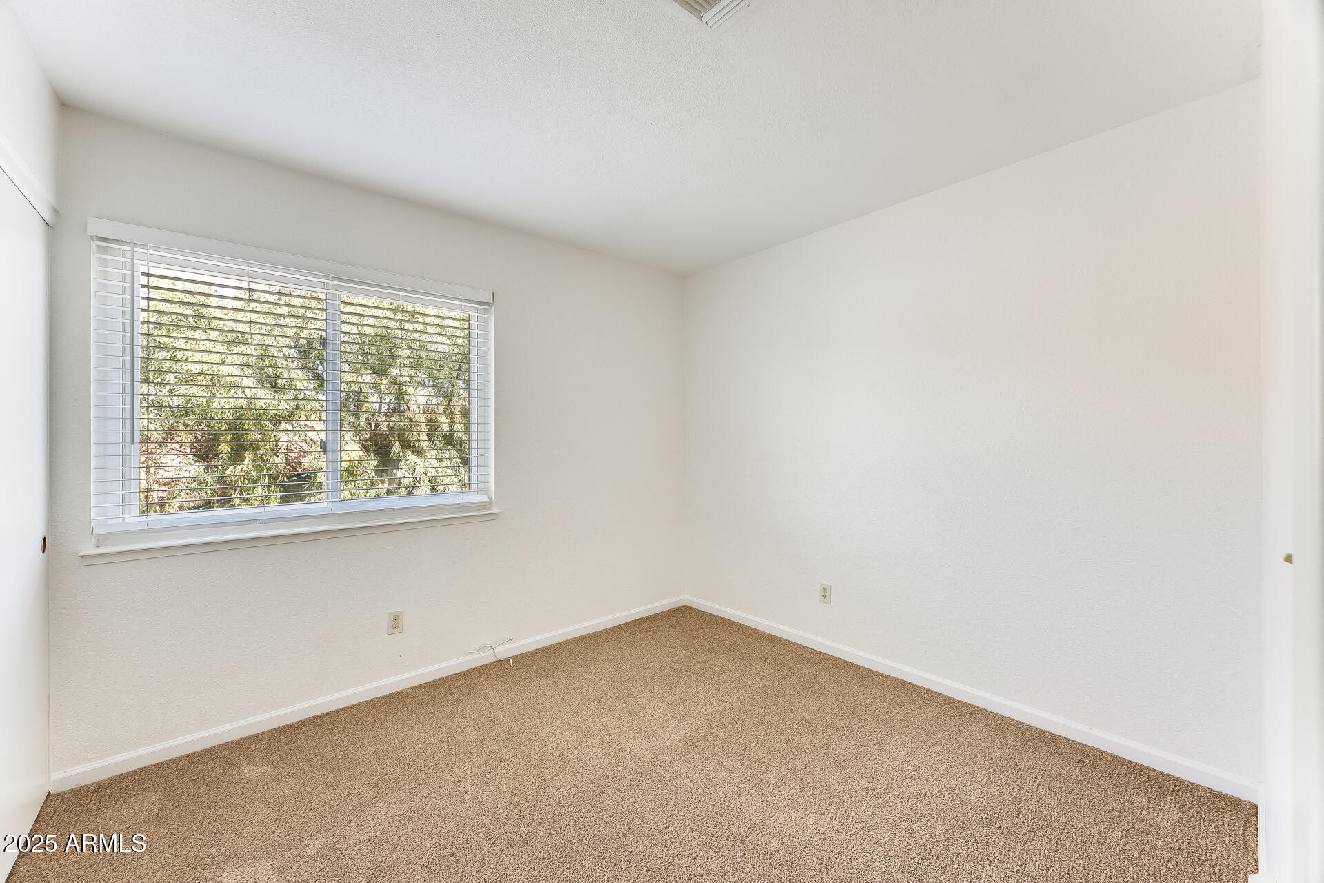 1929 East Redfield Road Phoenix, AZ 85022 - Photo 39 of 58 an empty room with a window