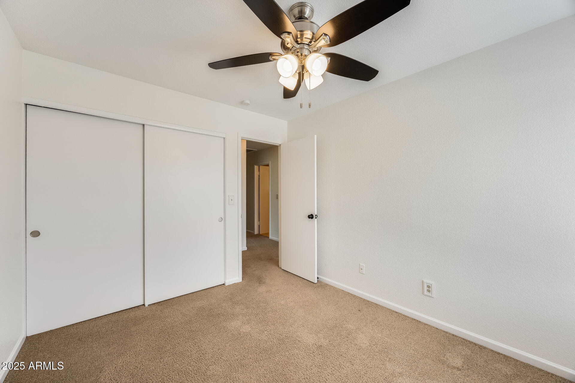 1929 East Redfield Road Phoenix, AZ 85022 - Photo 44 of 58 an empty room with a ceiling fan and a window