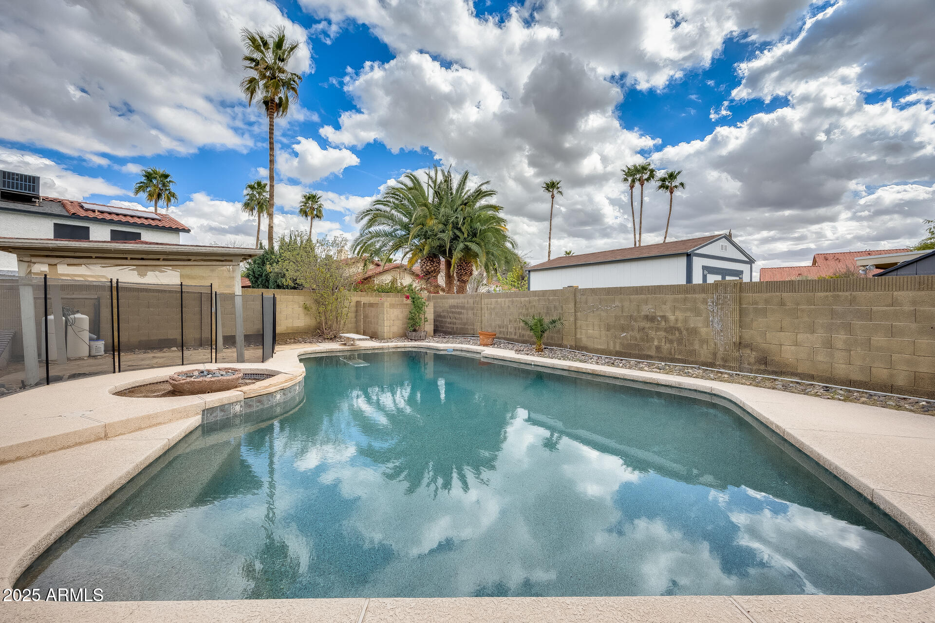 1929 East Redfield Road Phoenix, AZ 85022 - Photo 54 of 58 a view of a swimming pool with a yard