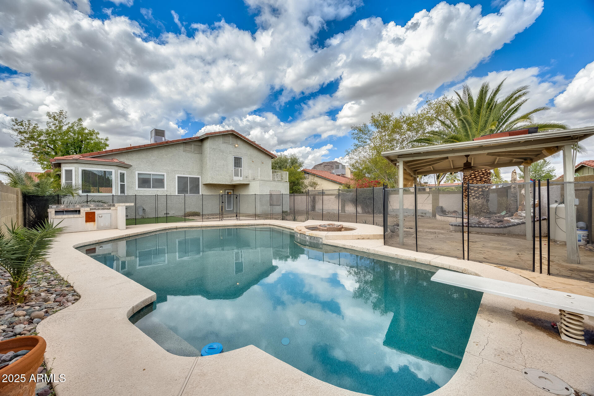 1929 East Redfield Road Phoenix, AZ 85022 - Photo 56 of 58 a view of a house with swimming pool and sitting area