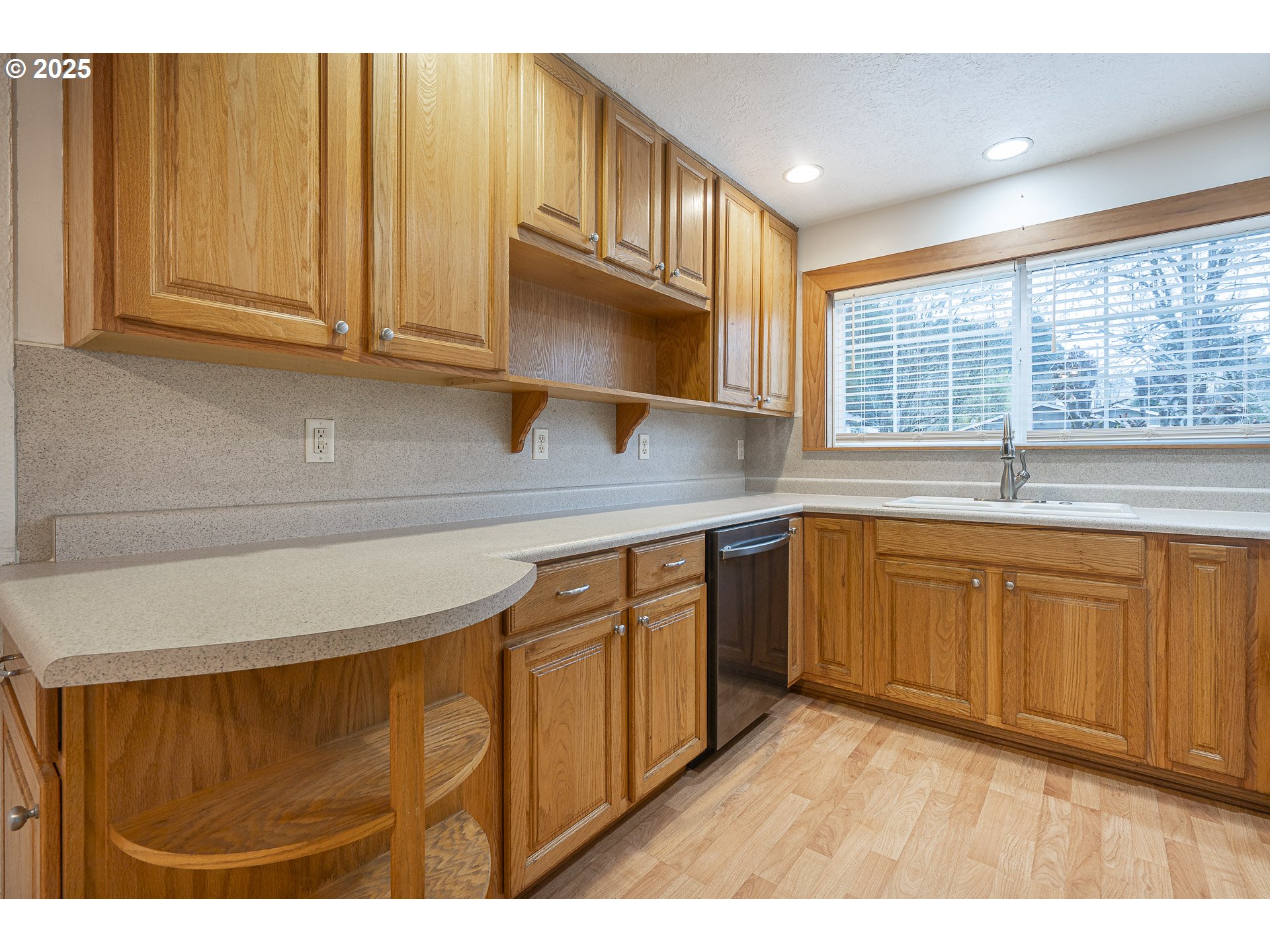 1155 18th Street Northeast Salem, OR 97301 - Photo 13 of 40 a kitchen with stainless steel appliances granite countertop a sink and cabinets