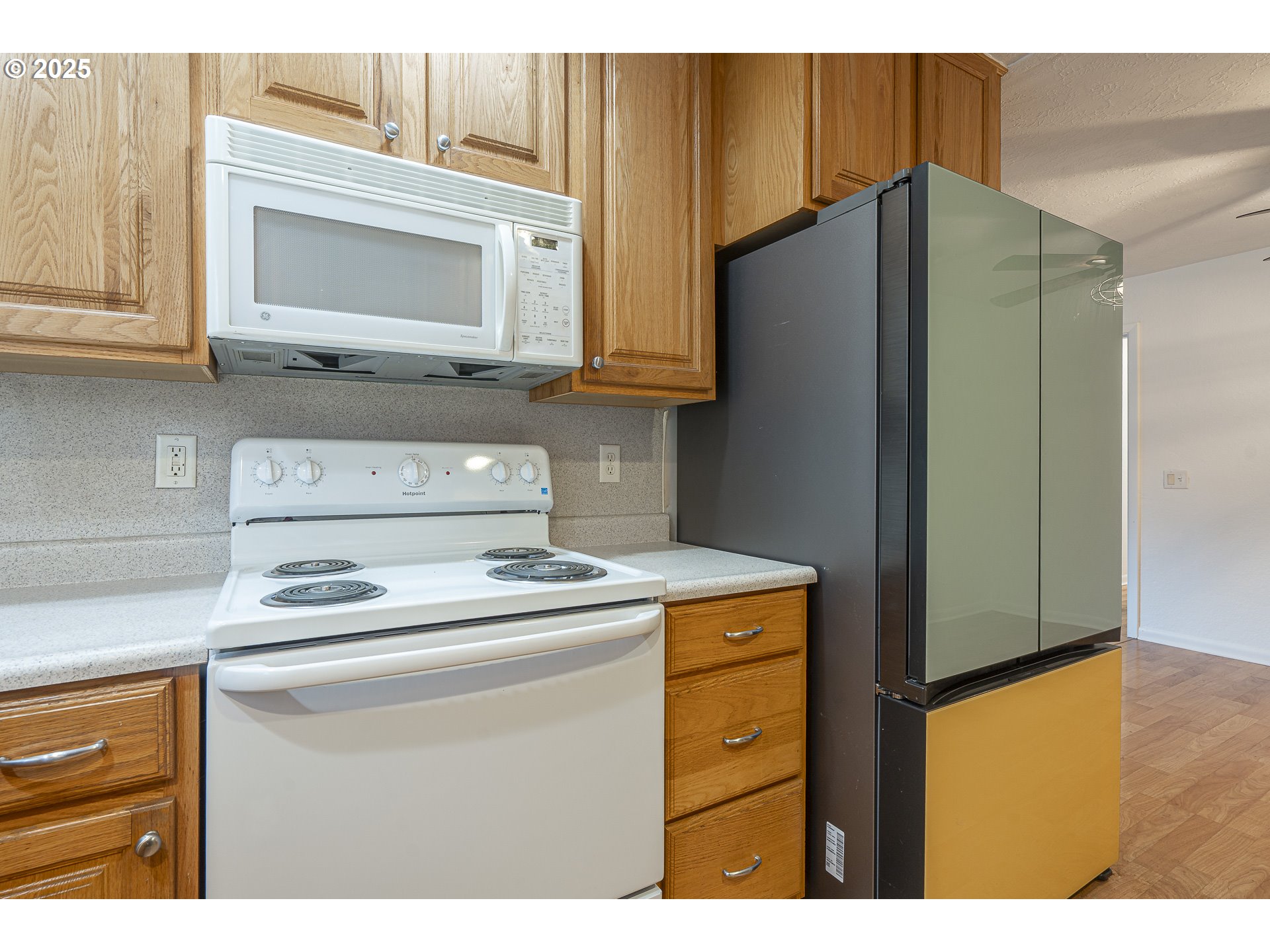1155 18th Street Northeast Salem, OR 97301 - Photo 16 of 40 a kitchen with stainless steel appliances granite countertop a refrigerator and a stove