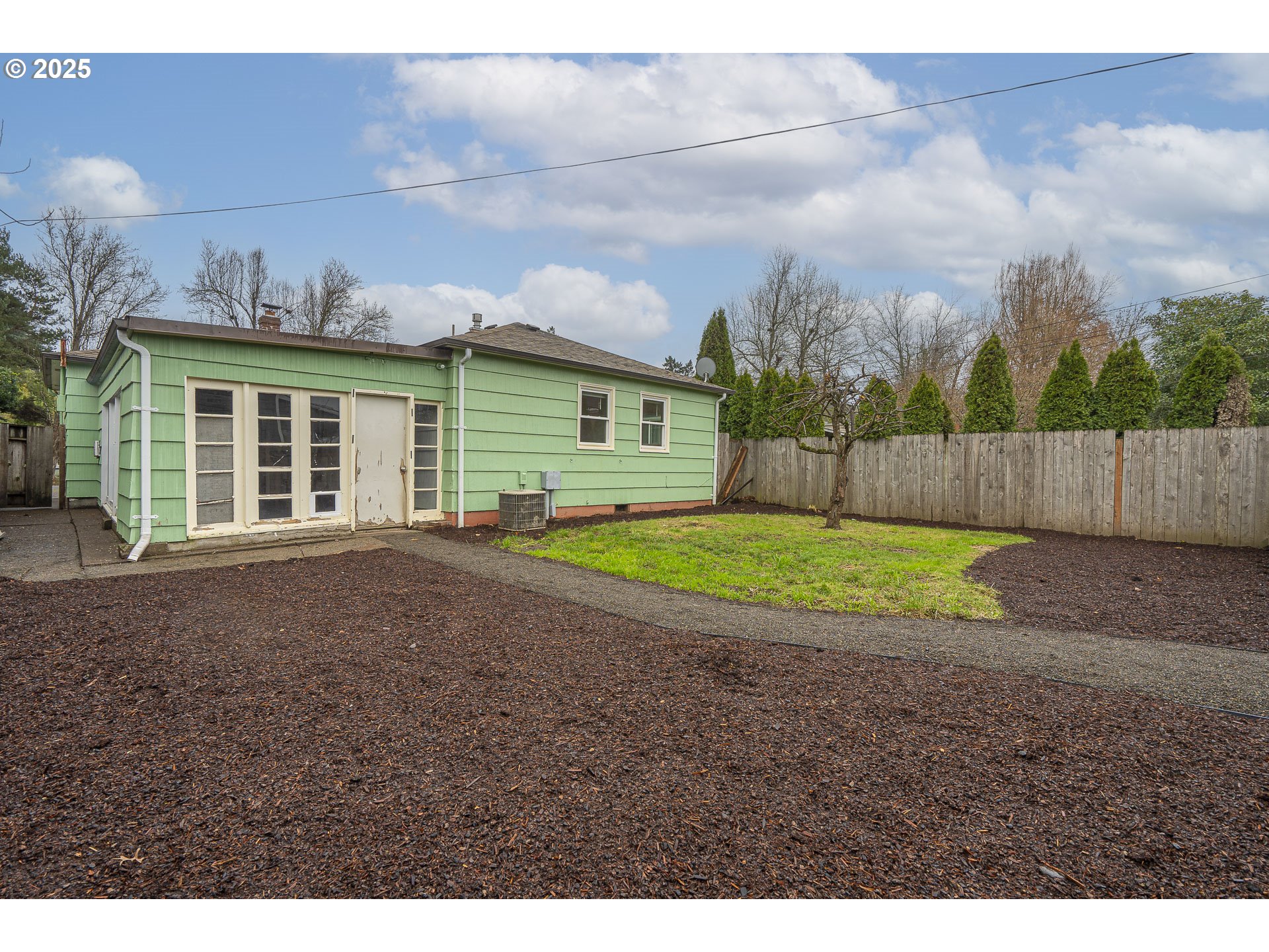 1155 18th Street Northeast Salem, OR 97301 - Photo 28 of 40 a view of a house with a backyard