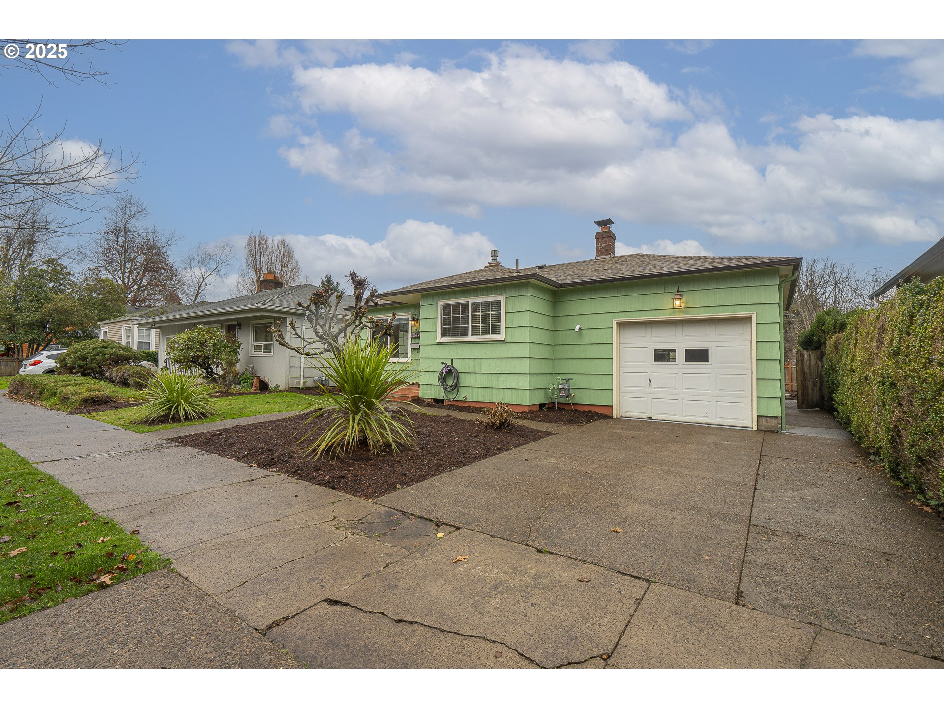 1155 18th Street Northeast Salem, OR 97301 - Photo 3 of 40 a view of a house with a yard and potted plants