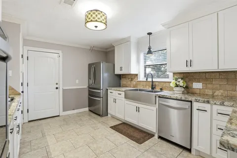 an empty room with a ceiling fan and carpet