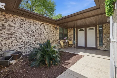 a view of an empty room and a window
