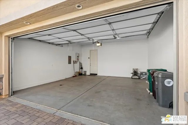 a view of a white house with a yard