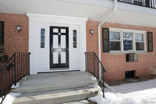 a front view of a house with a porch