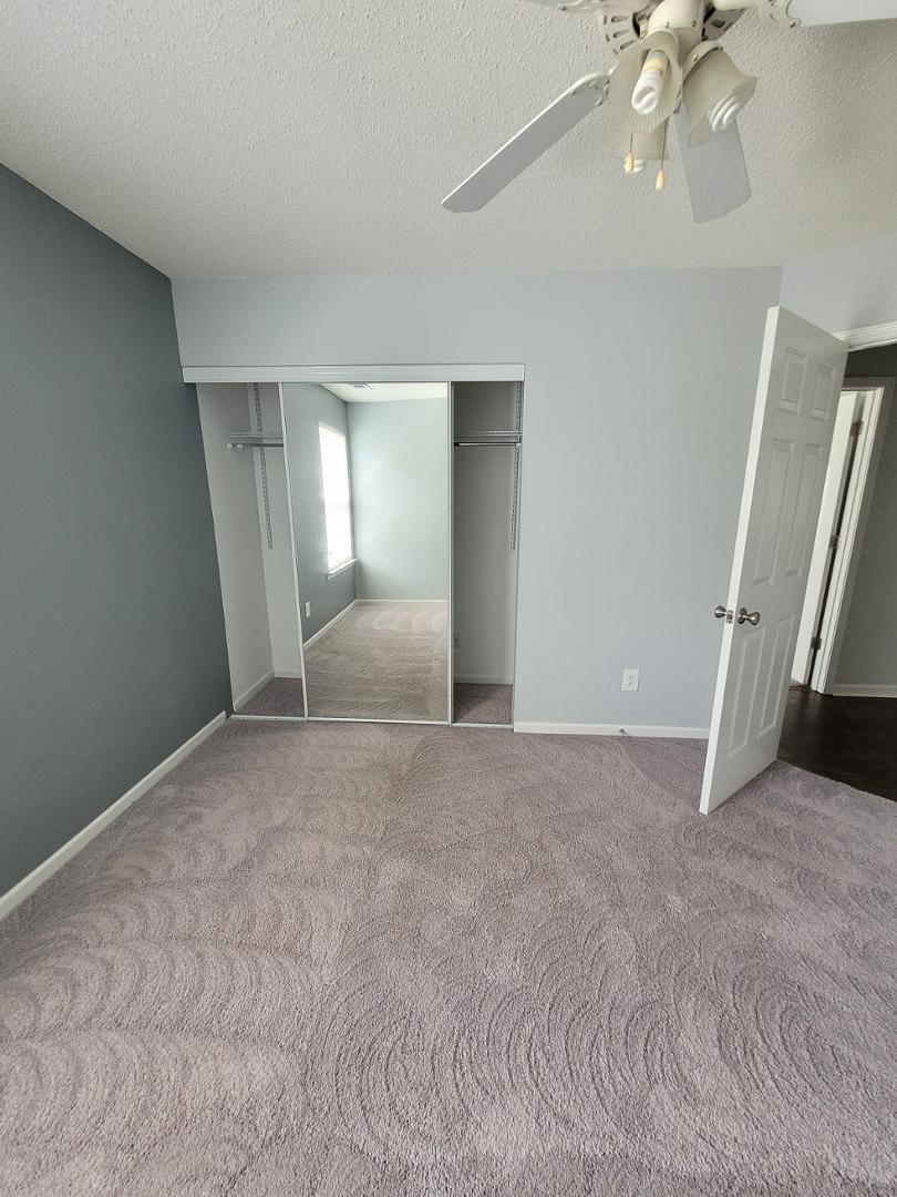 5517 Roan Place Raleigh, NC 27613 - Photo 24 of 35 a view of a livingroom with a staircase