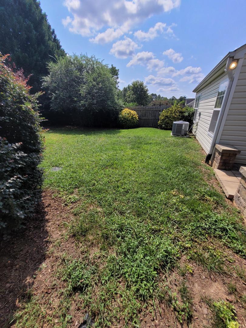 5517 Roan Place Raleigh, NC 27613 - Photo 31 of 35 a view of a garden with a building