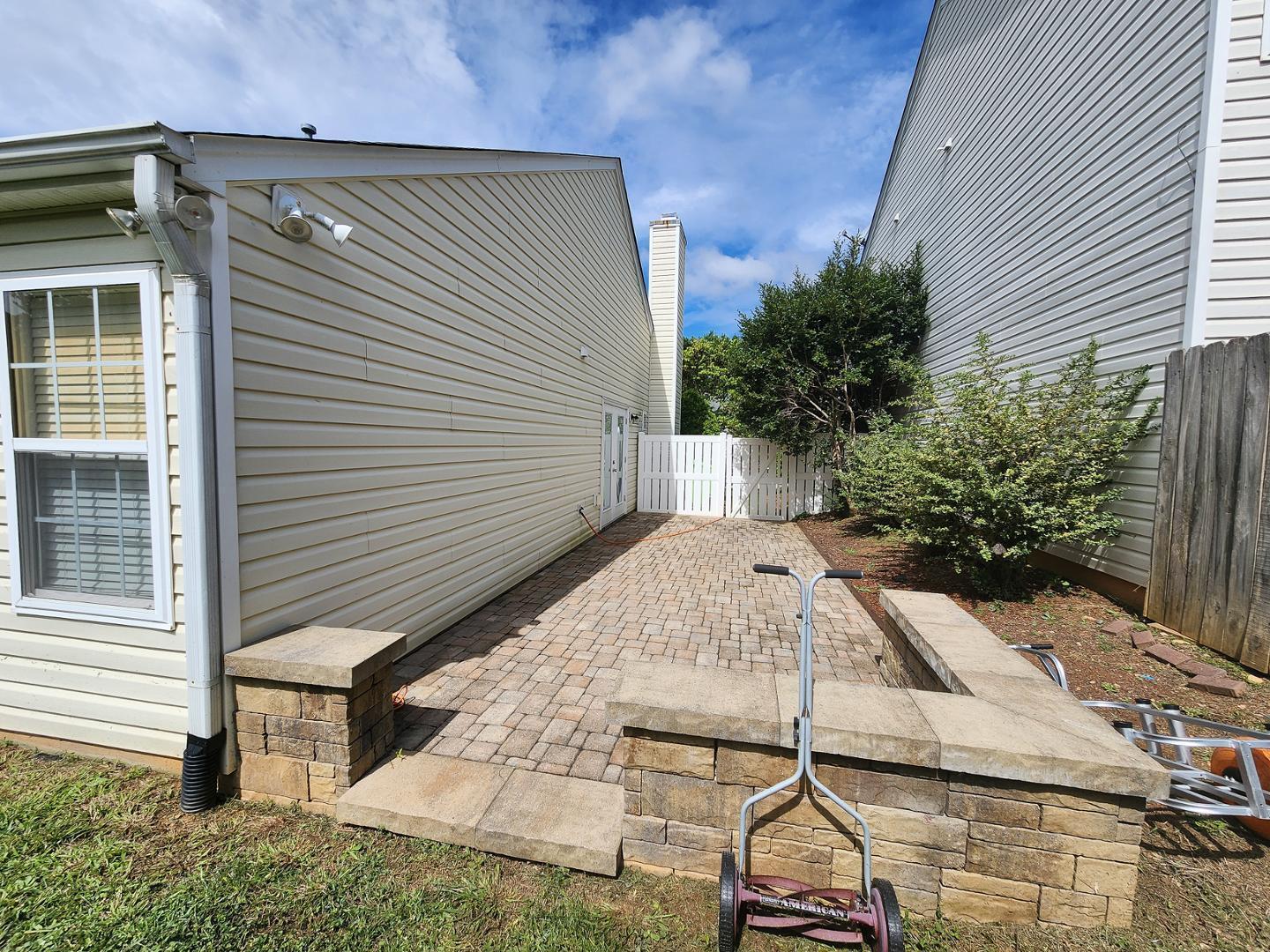 5517 Roan Place Raleigh, NC 27613 - Photo 33 of 35 a view of a house with a yard and sitting area