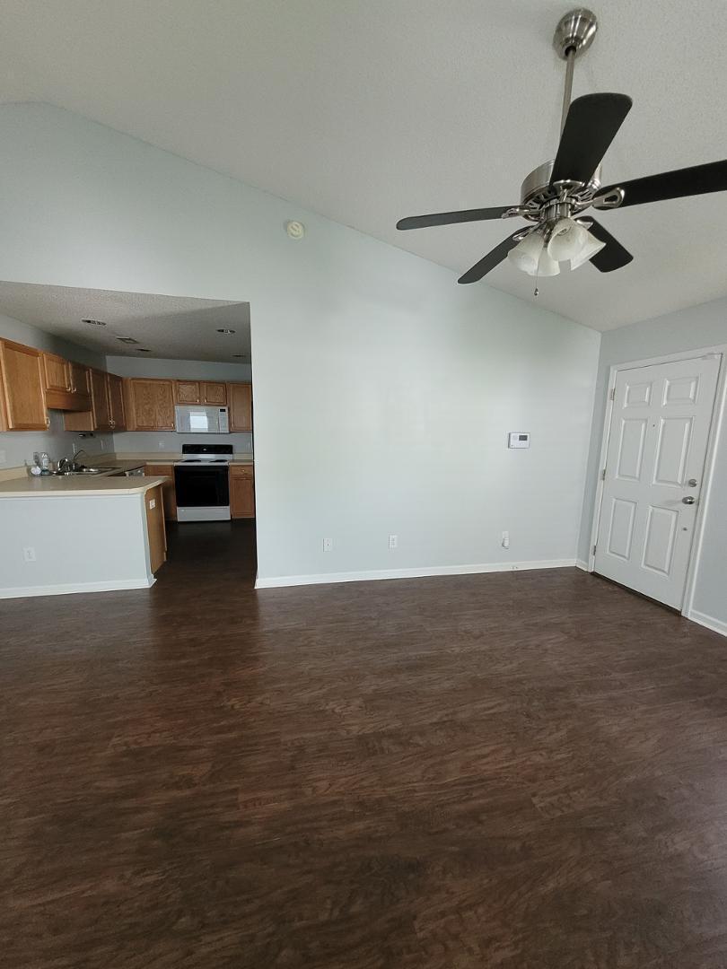 5517 Roan Place Raleigh, NC 27613 - Photo 4 of 35 a view of a kitchen and an empty room