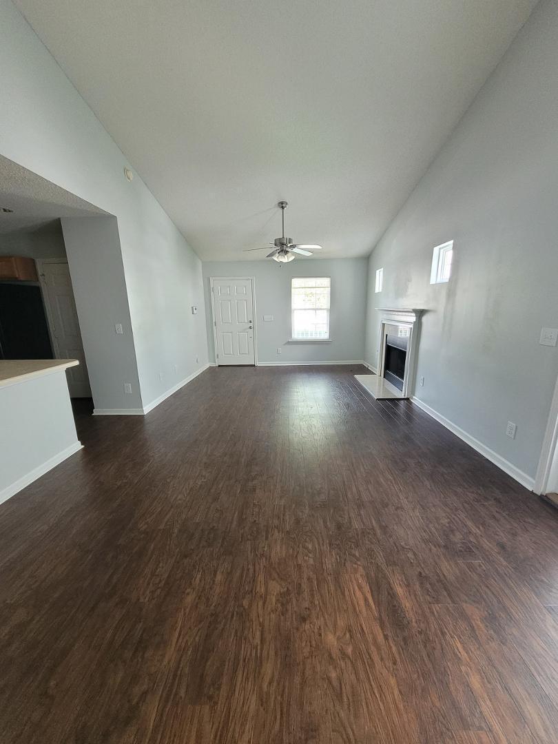 5517 Roan Place Raleigh, NC 27613 - Photo 8 of 35 wooden floor in an empty room with a window