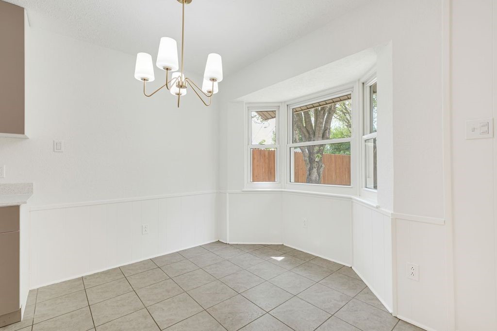 4518 Seneca Street Pasadena, TX 77504 - Photo 11 of 26 a view of an empty room with windows