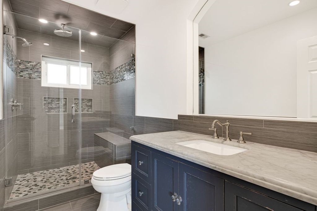 4518 Seneca Street Pasadena, TX 77504 - Photo 14 of 26 a bathroom with a sink toilet and shower