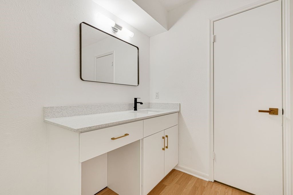 4518 Seneca Street Pasadena, TX 77504 - Photo 17 of 26 a bathroom with a sink and a mirror